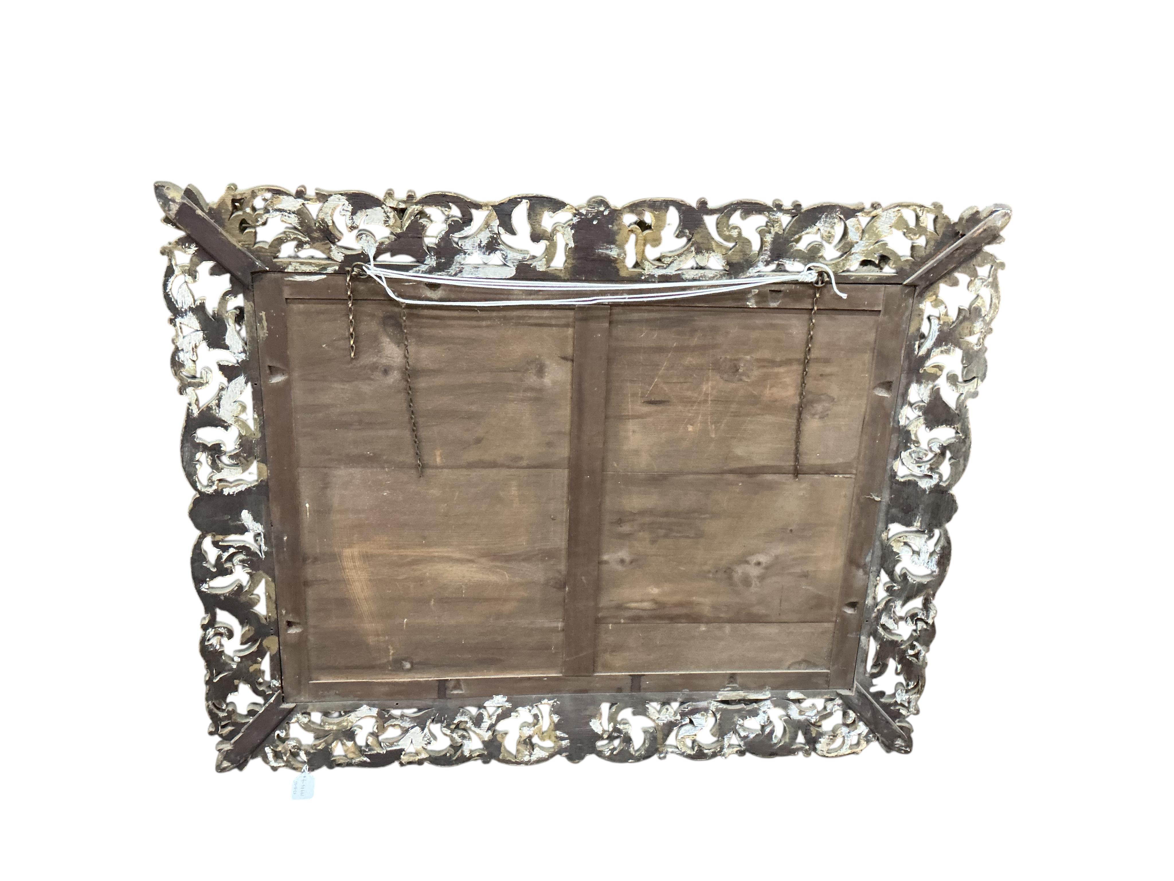 A large late 19th / early 20th century rectangular carved giltwood wall mirror, width 97cm, height 124cm